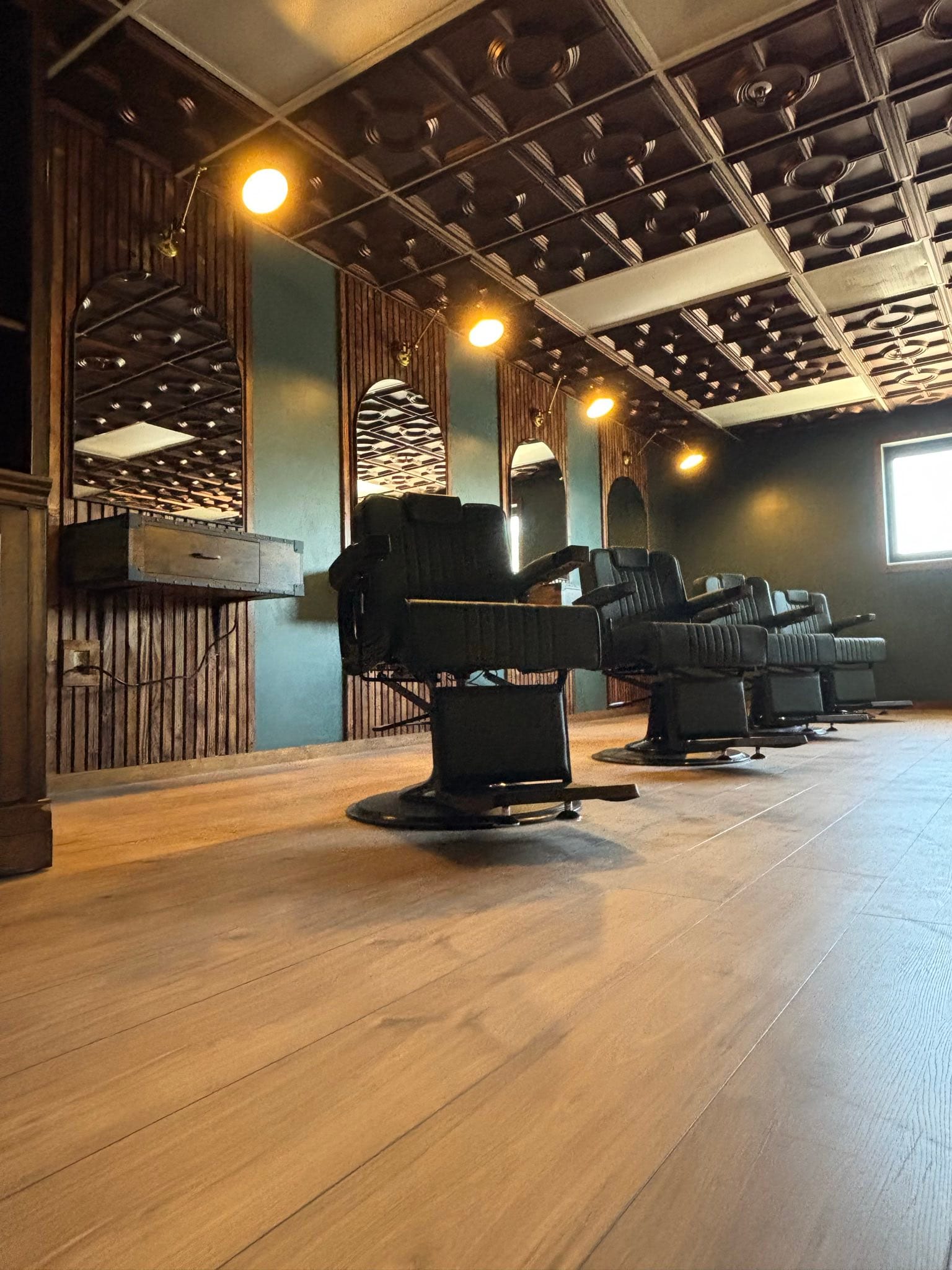 Premium barber chairs at Cache Cuts Logan Utah barbershop with luxury atmosphere